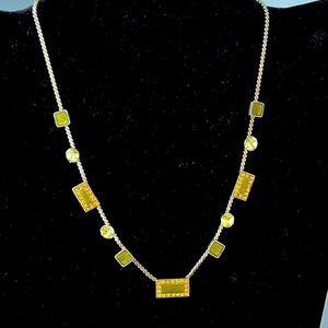 Silver statement necklace with green and amber stones